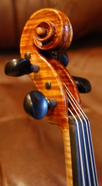 Close-up of scroll of 3/4-size Oliver violin
