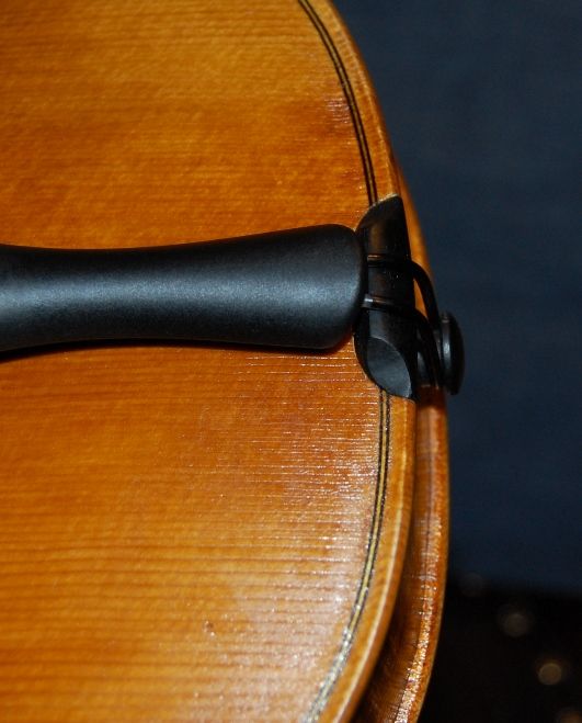 Completed saddle, end-button and tailpiece