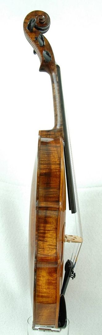 Bass side view of an Oliver acoustic Five-string Fiddle, showing the curly Koa ribs. Handmade in Oregon by Chet Bishop.