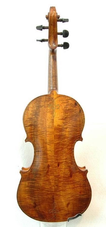 Curly Koa back of an Oliver acoustic Five-string Fiddle. Handmade in Oregon by Chet Bishop.