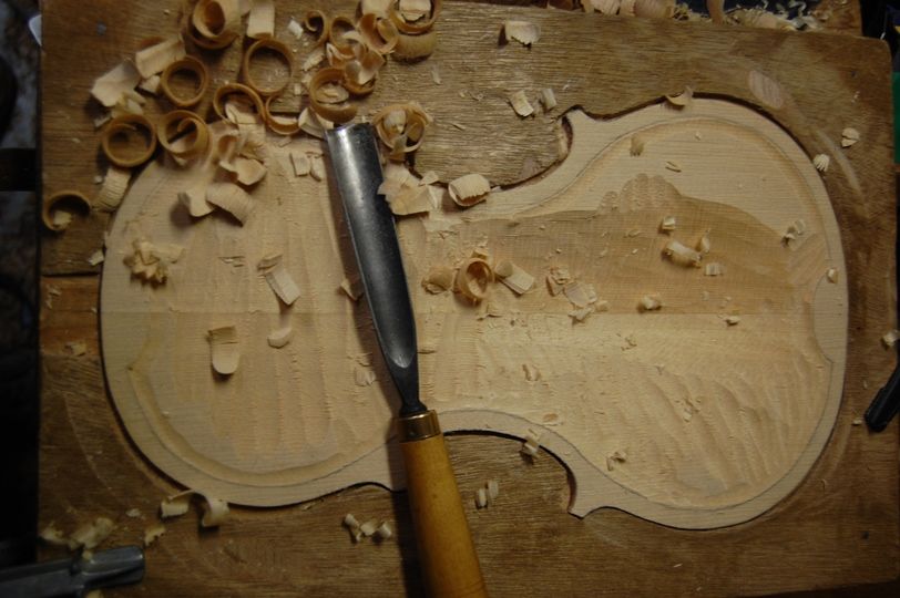 carving inside violin front plate