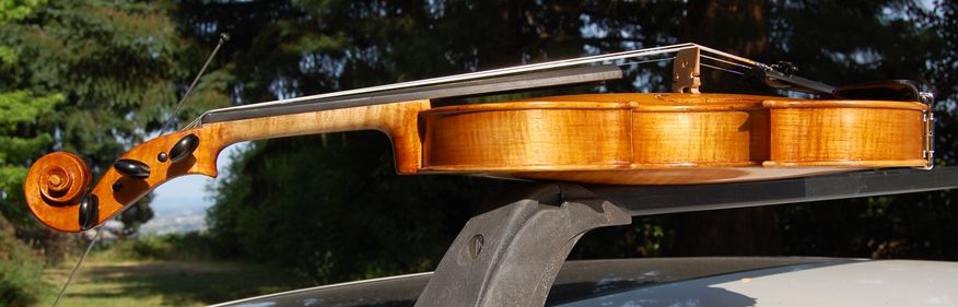 Side of an Oliver acoustic Five String bluegrass Fiddle. Handmade in Oregon by Chet Bishop.