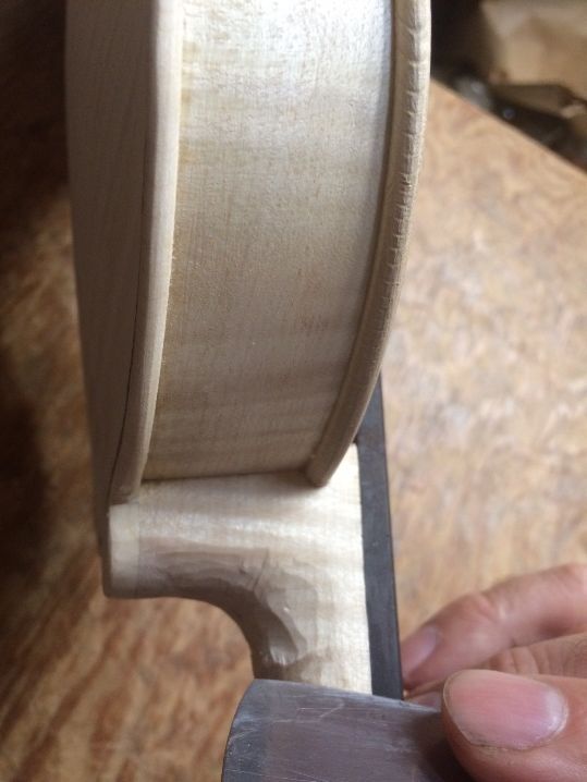 Shaping and scraping the heel.