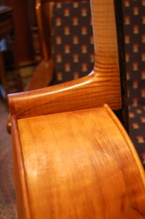 Neck joint of cello with one coat of varnish.