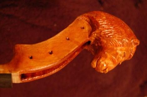 Scroll of lion-head viola with final varnish